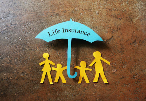 paper family with life insurance umbrella